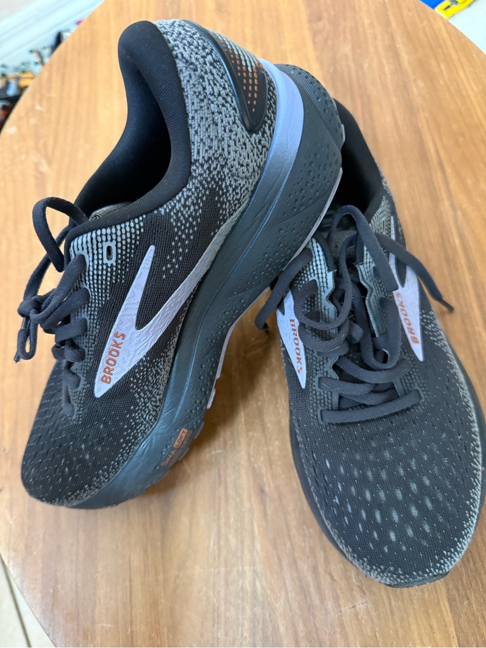 Brooks Black and Gray Athletic Running Shoes with Subtle Orange Accents